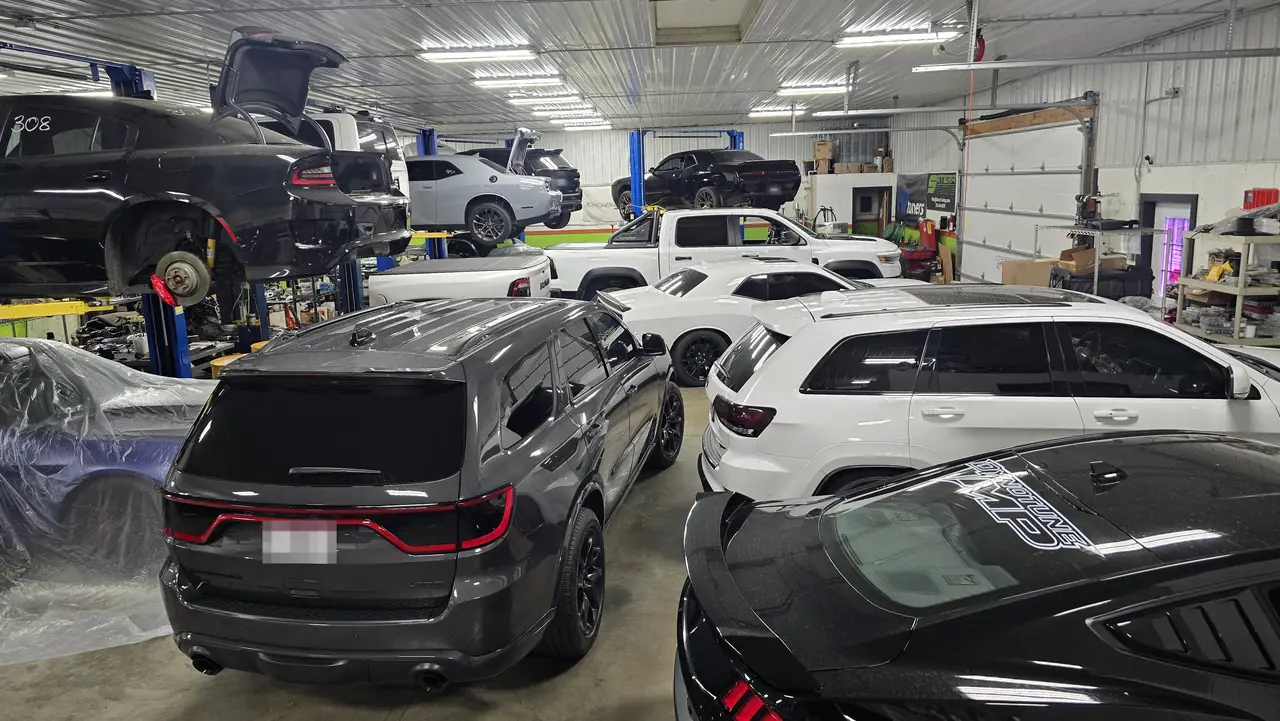 Inside the Satera Tuning shop in Hampshire, IL with Dodge, Jeep and Ram vehicles in service